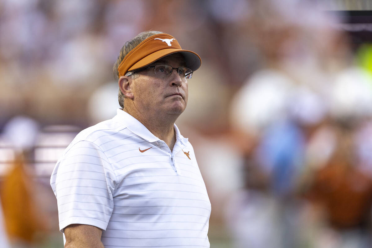 Gary Patterson, special assistant to the Texas football coach, walks the sideline at the team's ...