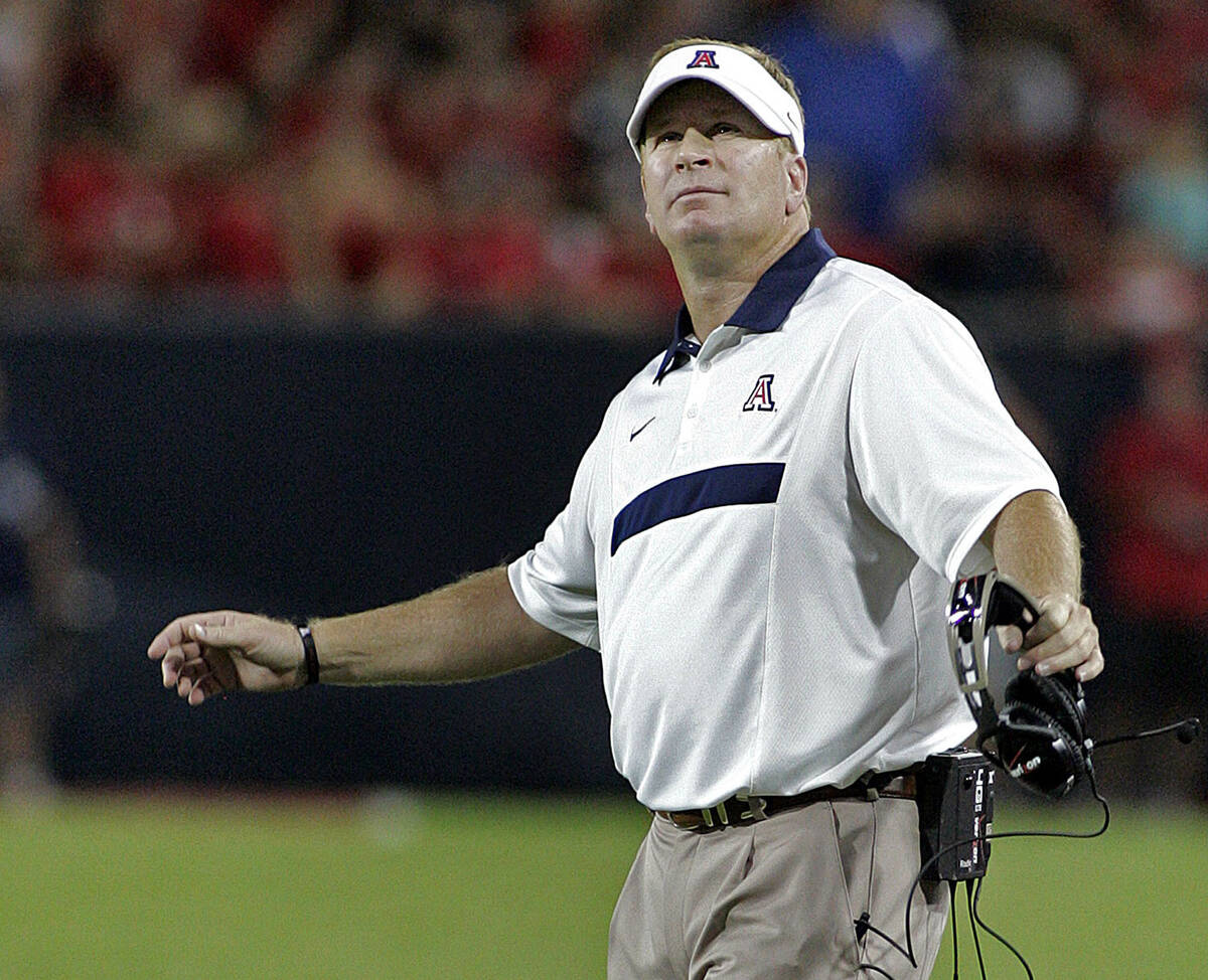 In this Sept. 3, 2011 file photo, Arizona coach Mike Stoops looks at the stadium video screen d ...