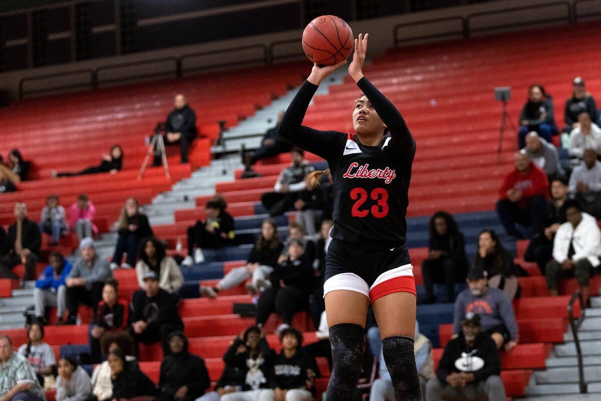 Liberty’s Adrienne Puletasi (23) jumps to shoot a three-pointer against Clark during a h ...