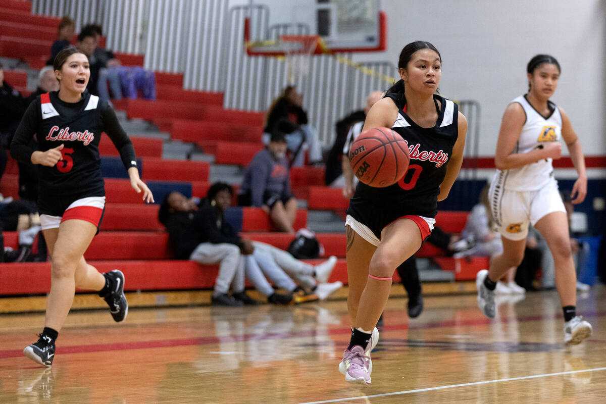 Liberty’s Jossy Calico (0) breaks away with the ball during a high school girls basketba ...