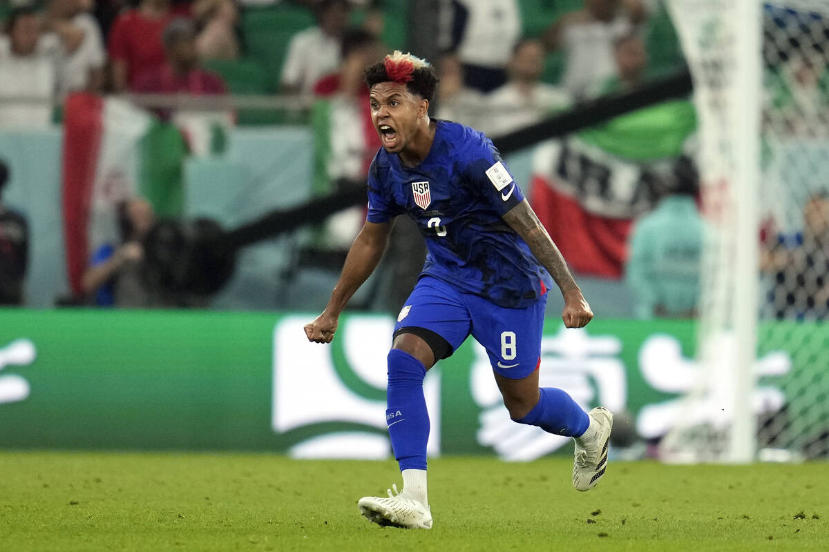 United States' Weston McKennie (8) celebrates after teammate Christian Pulisic scoring a goal d ...