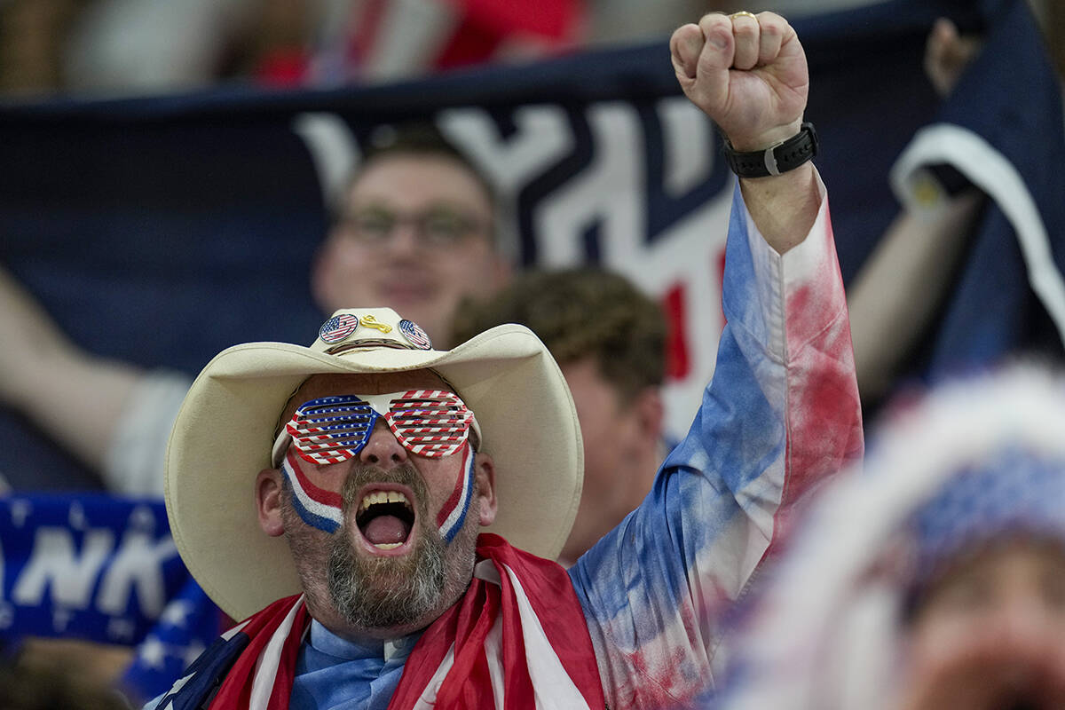 A supporter cheers prior to the World Cup group B soccer match between Iran and the United Stat ...