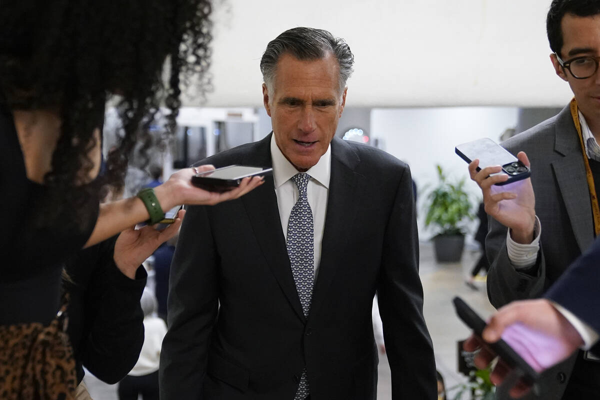 FILE - Sen. Mitt Romney, R-Utah, speaks with members of the press Nov. 16, 2022, on Capitol Hil ...