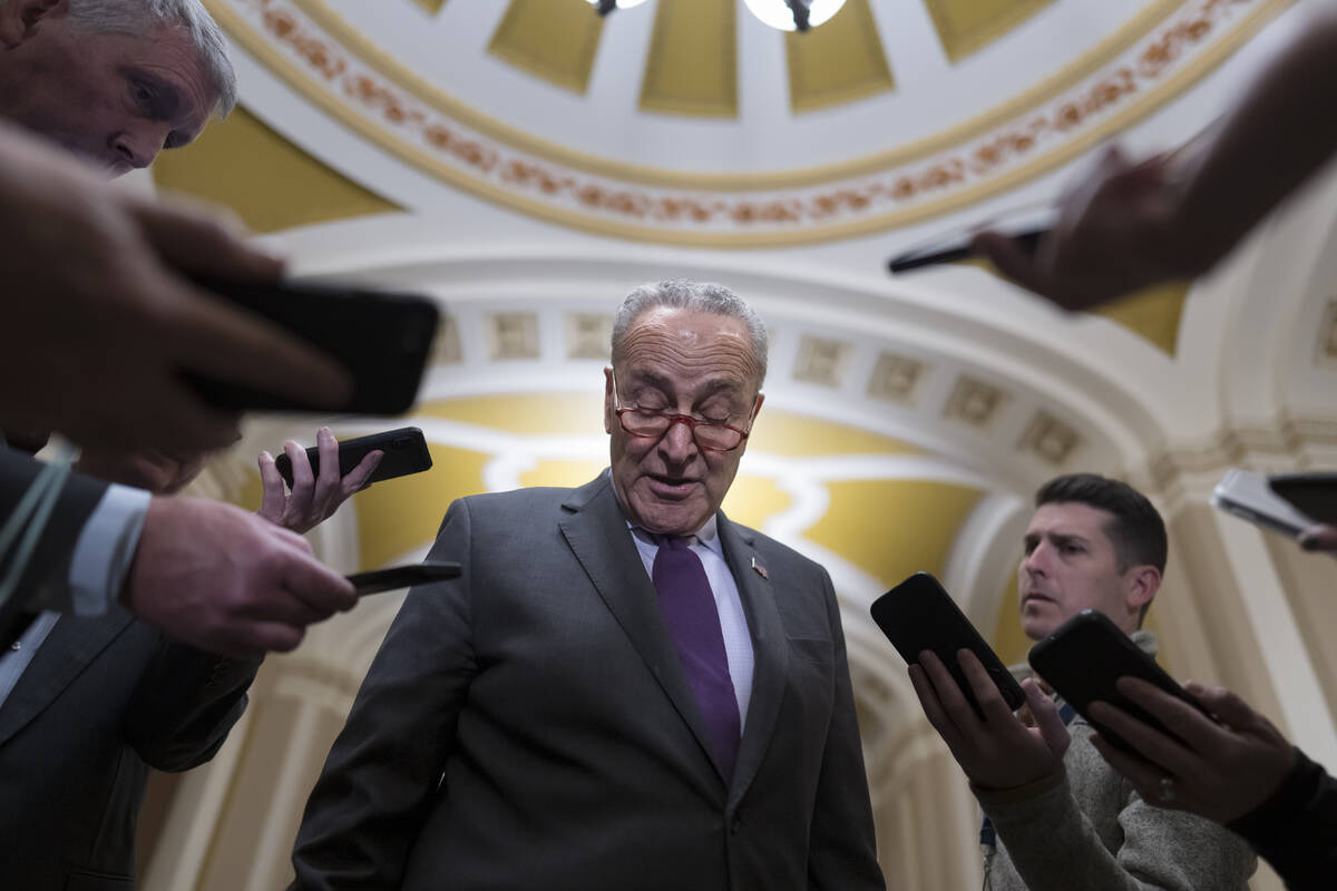 Senate Majority Leader Chuck Schumer, D-N.Y., briefs reporters as he returns from a White House ...