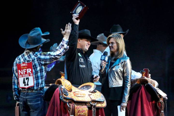 Trevor Brazile of Decatur, Texas (2) is honored on stage after becoming the 2018 PRCA All Aroun ...