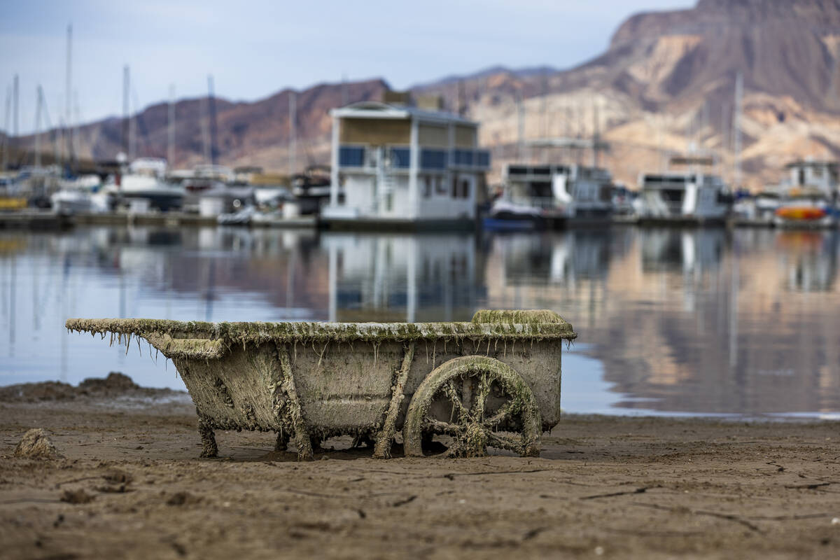 An old cart is stuck in the muck about the Las Vegas Boat Harbor as the waterline continues to ...