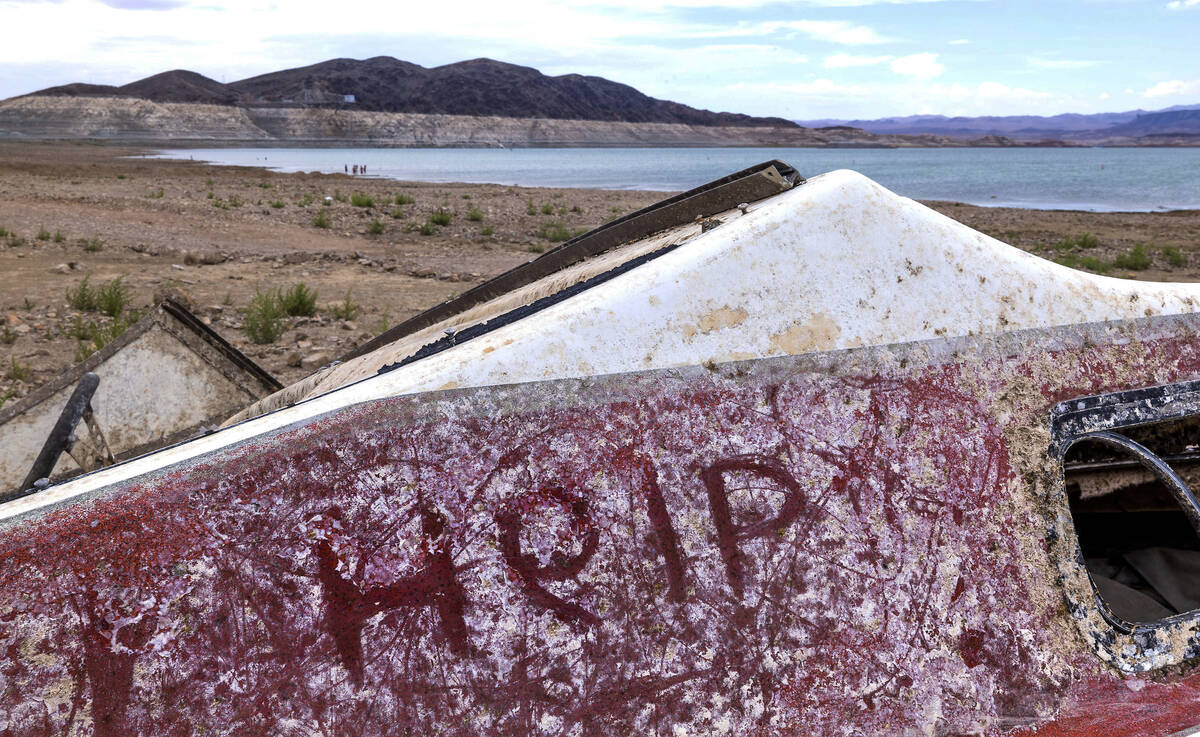 A message on another abandoned boat resting up above the waterline where a body was found at Sw ...