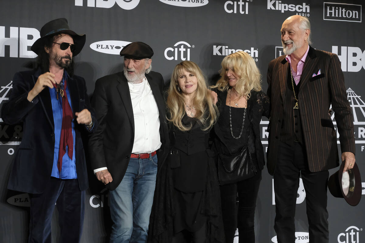 Inductee Stevie Nicks, center, poses with from left, Mike Campbell, John McVie, Christine McVie ...