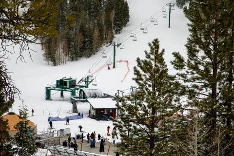 Skiers and snowboarders take to the several new inches of recently fallen snow at Lee Canyon on ...