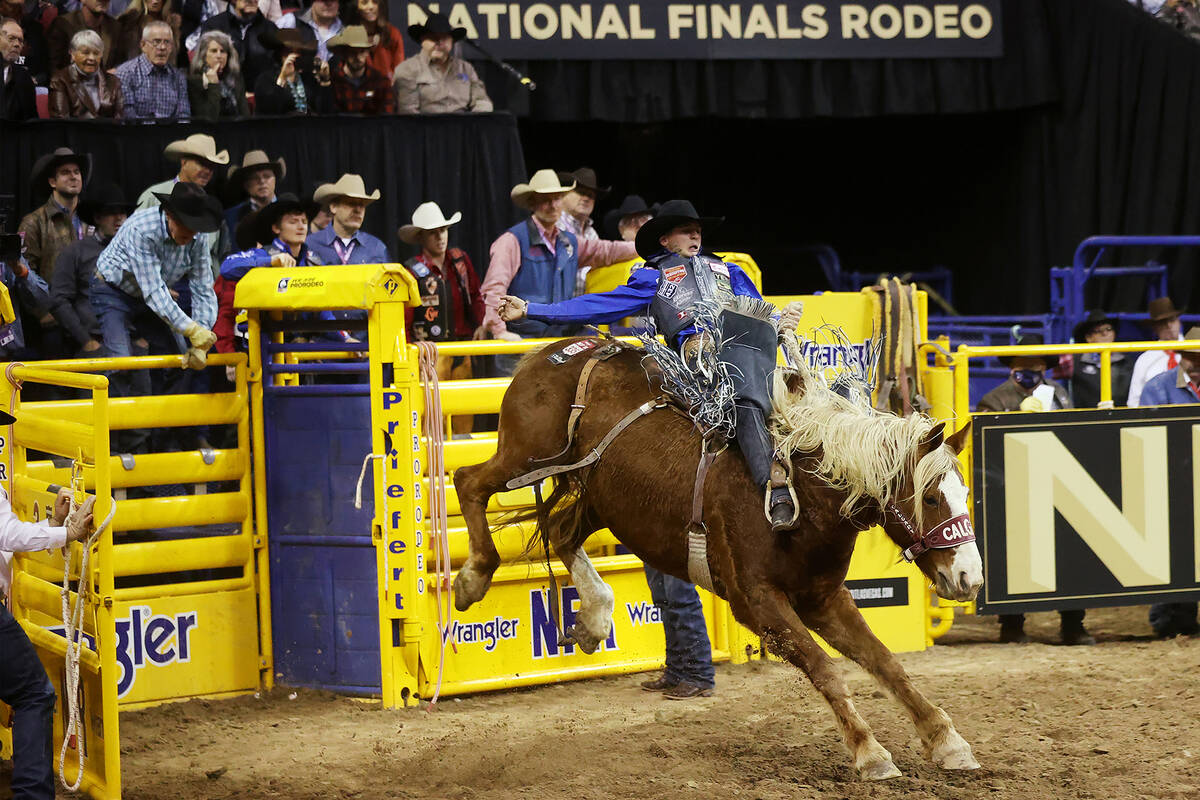 Stetson Wright of Milford, Utah, competes in the saddle bronc riding event during the ninth go- ...