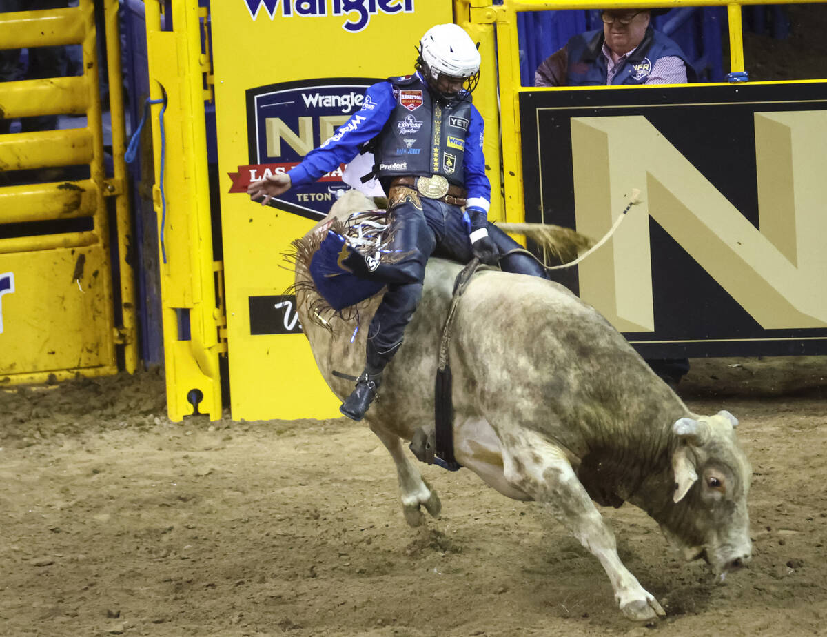 Stetson Wright, of Milford, Utah, competes in bull riding during the first night of the Nationa ...