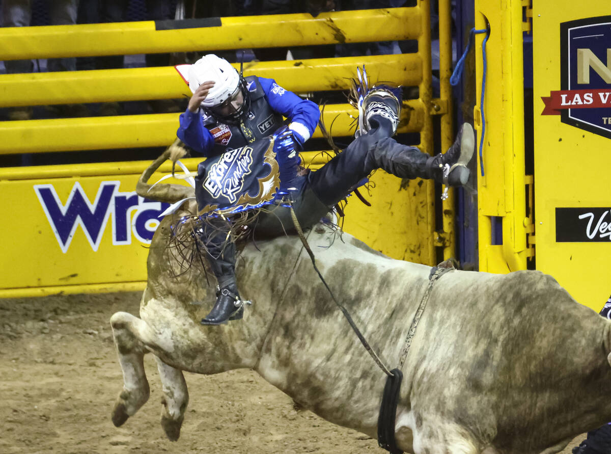 Stetson Wright, of Milford, Utah, competes in bull riding during the first night of the Nationa ...