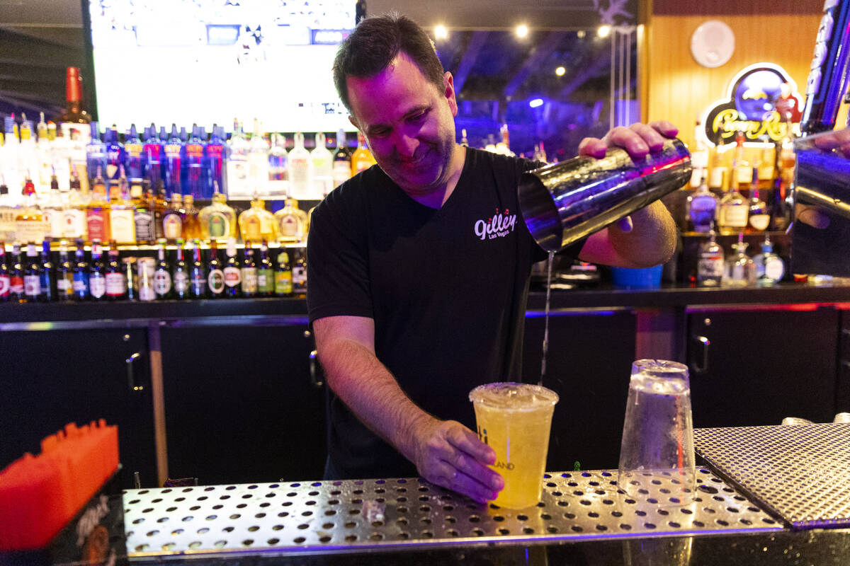 Bartender David Taylor prepares a drink at Gilley's Saloon inside of Treasure Island hotel-casi ...