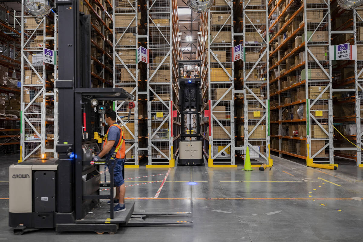 Production occurs at an Amazon warehouse in North Las Vegas on Thursday, July 30, 2020. (Elizab ...