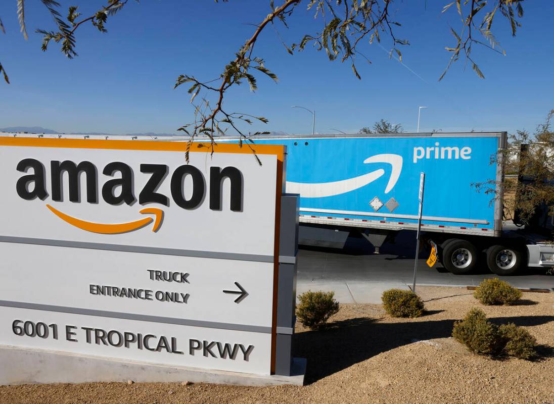 An Amazon Prime truck enters Amazon Distribution Center at an industrial area centered around T ...