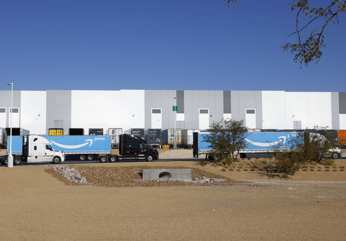 Amazon Prime trucks enter Amazon Distribution Center at an industrial area centered around Trop ...