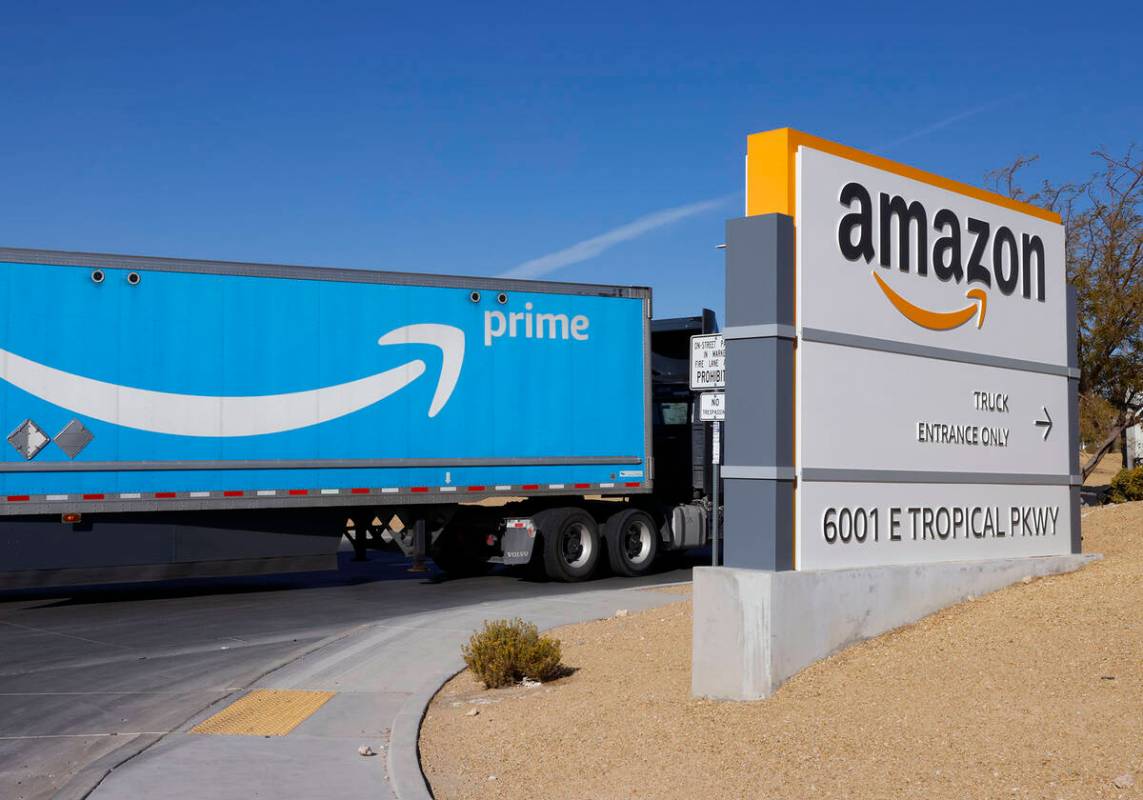 An Amazon Prime truck enters Amazon Distribution Center at an industrial area centered around T ...