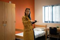 Sara Georgievska, program manager for Rite of Passage, gives a tour of a new juvenile justice f ...