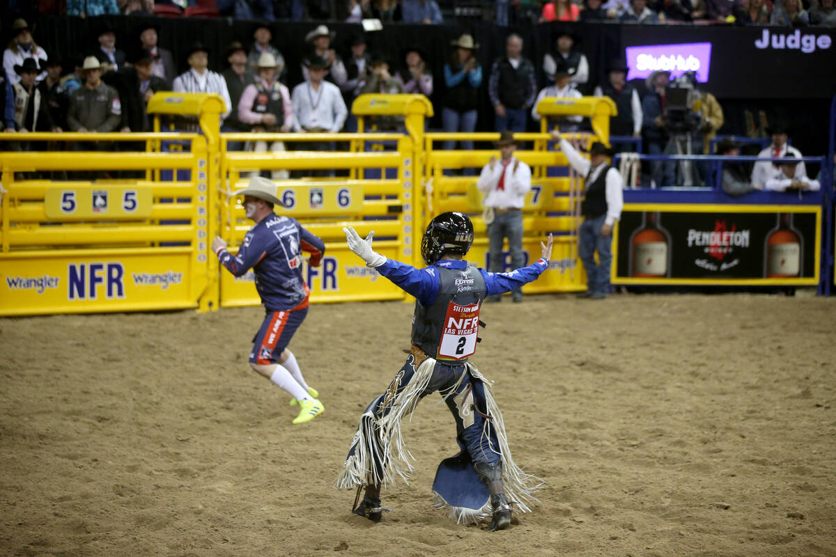 Bull rider Stetson Wright of Milford, Utah, celebrates his 92.5 ride on Monte Walsh which won t ...