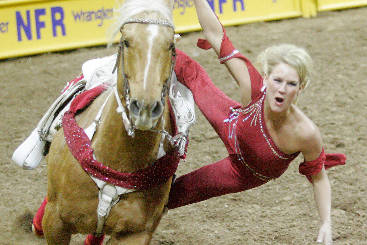 Rodeo stunt rider Niki Moran entertains the crowd during the bull riding portion of the fourth ...