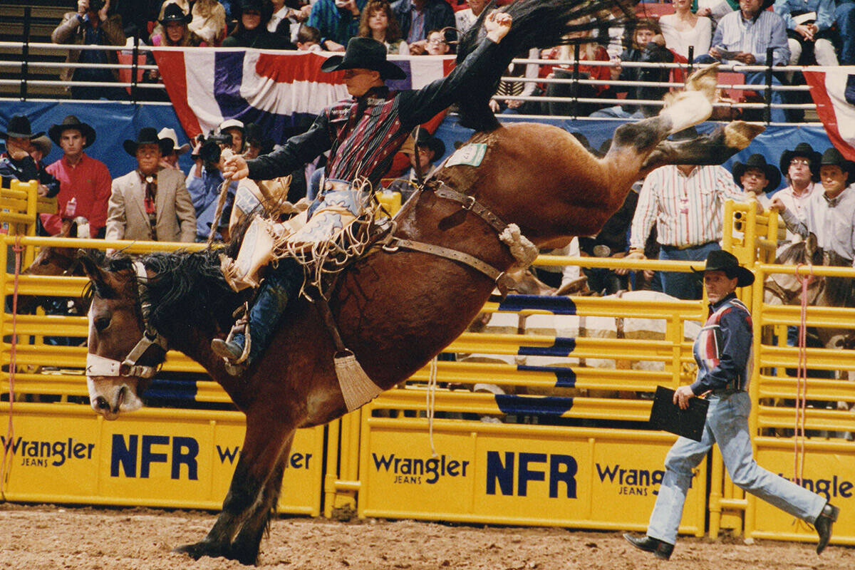 Professional saddle bronc rider Ty Murray rides during the Wrangler National Finals Rodeo on De ...