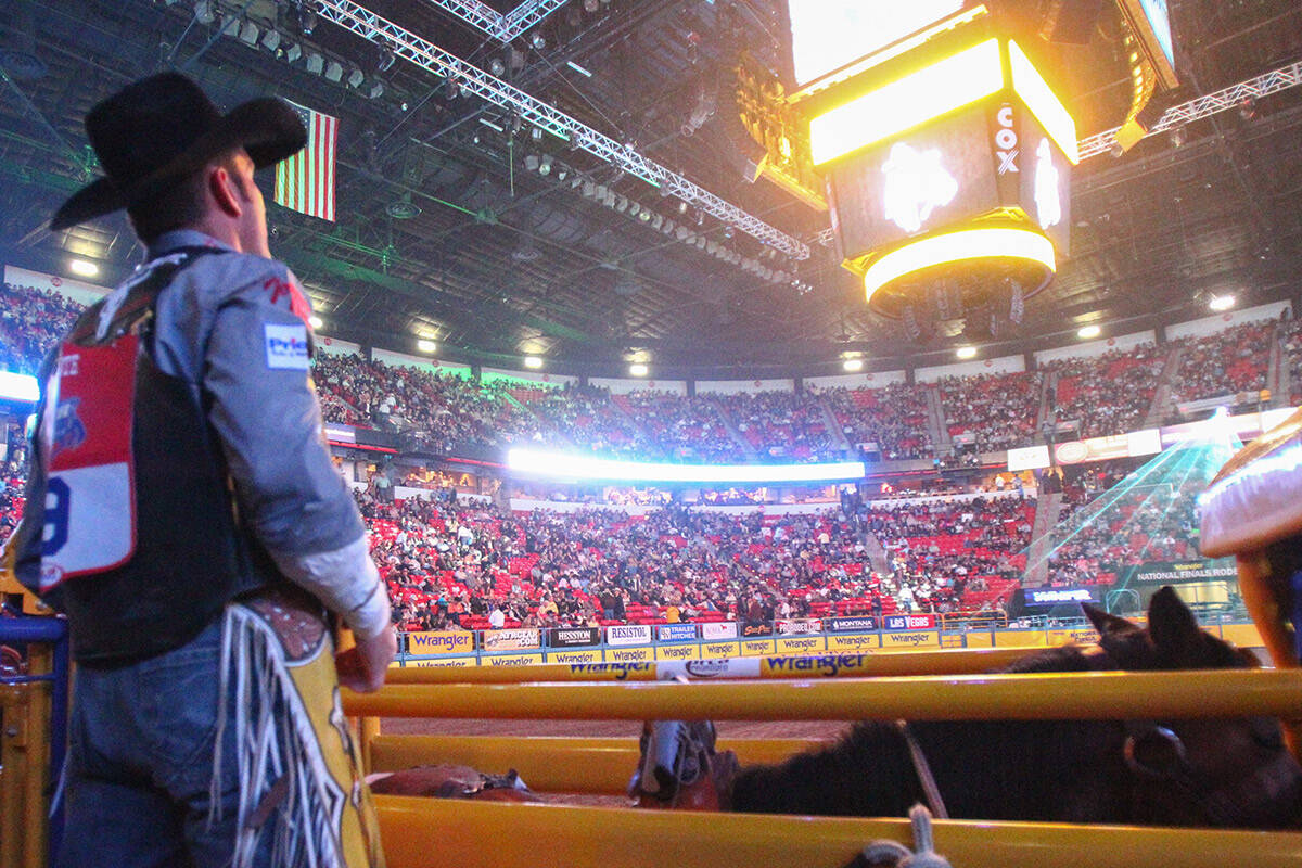 Bobby Mote of Stephenville, TX., looks out at the arena before the Round 3 of the Bareback Ridi ...