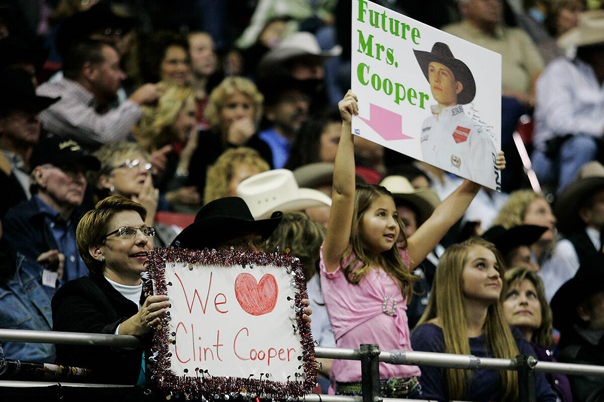 Fans show support for their favorite cowboys during day 8 of the Wrangler National Finals Rodeo ...