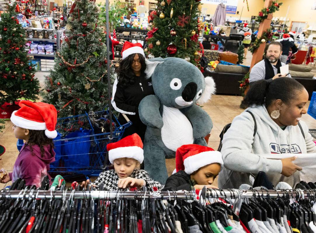 Children shop with their parents at Goodwill Thrift Store, on Friday, Dec. 2, 2022, in Henderso ...