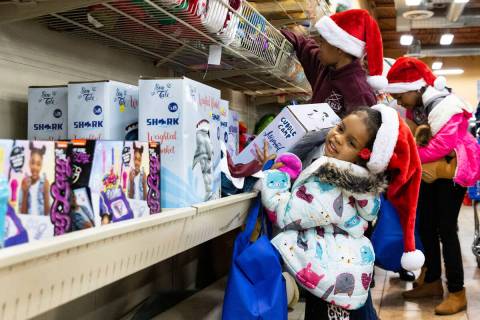 Sophia Wilson, 4, front, and her sister Atina Pagan, 9, center, shop at Goodwill Thrift Store, ...