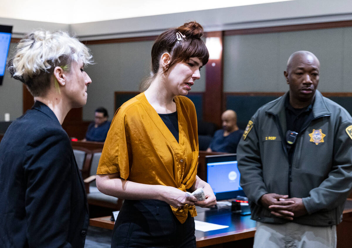 Amanda Dawn Potter, center, daughter of the murder victim Richard Miller, returns to her seat a ...