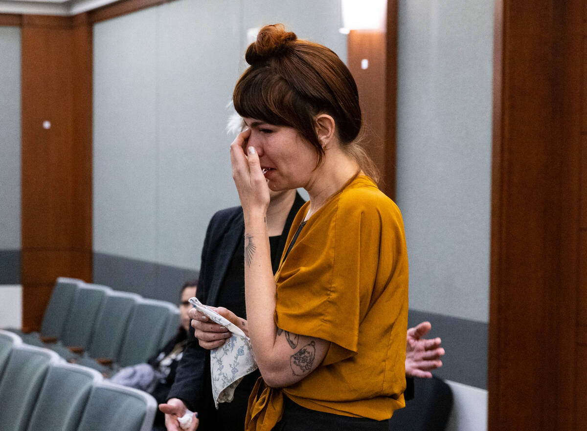Amanda Dawn Potter, daughter of the murder victim Richard Miller, gets emotional as she takes t ...