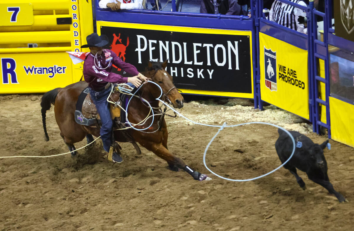 Shane Hanchey, of Sulphur, La., competes in tie-down roping during the first night of the Natio ...