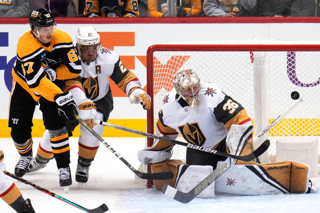 Pittsburgh Penguins' Rickard Rakell (67) cannot get a shot past Vegas Golden Knights goaltender ...