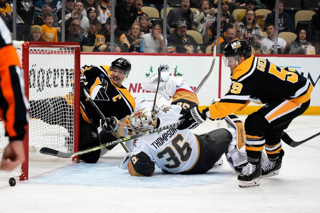 Pittsburgh Penguins' Jake Guentzel (59) cannot reach the puck behind Vegas Golden Knights goalt ...