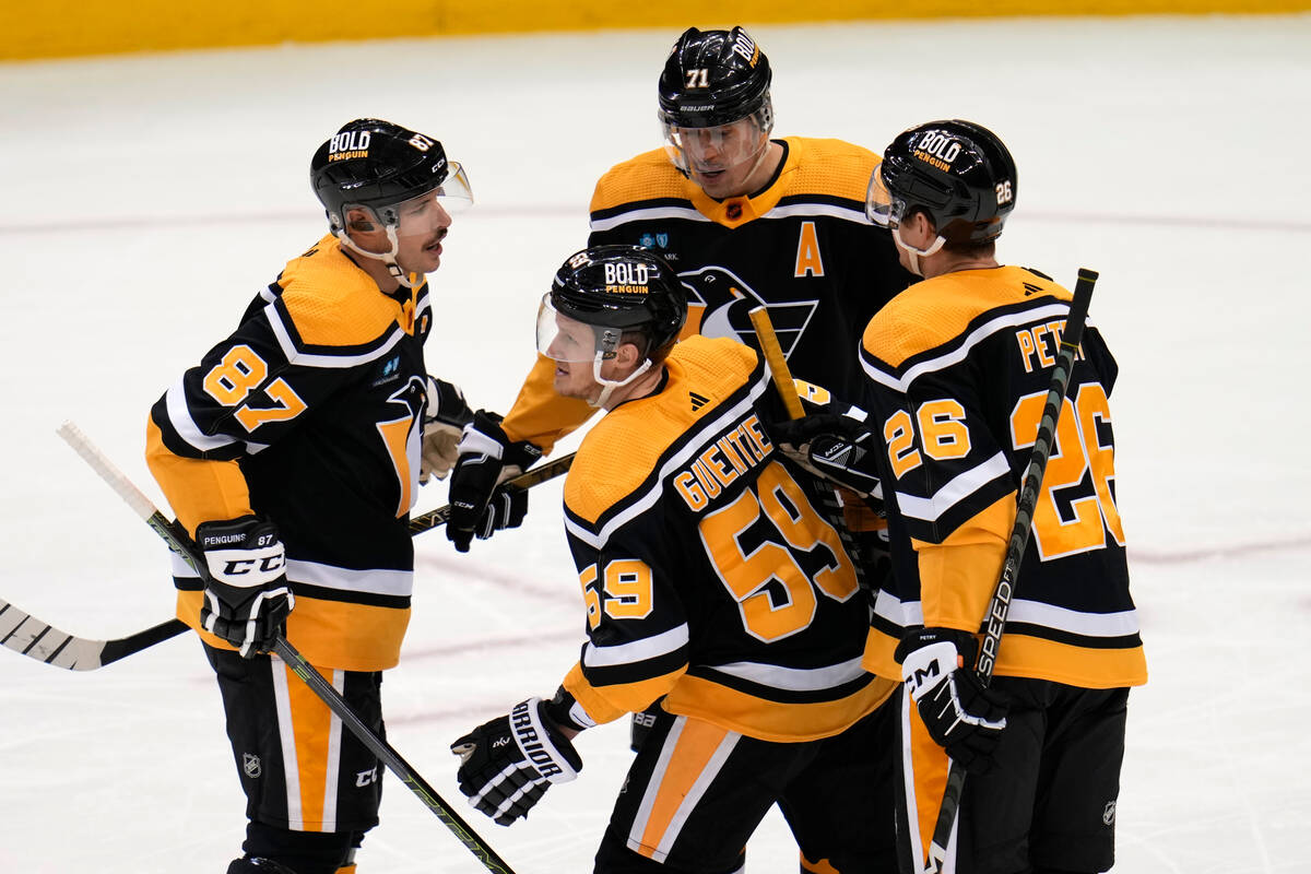 Pittsburgh Penguins' Jake Guentzel (59) heads to the bench after scoring during the third perio ...