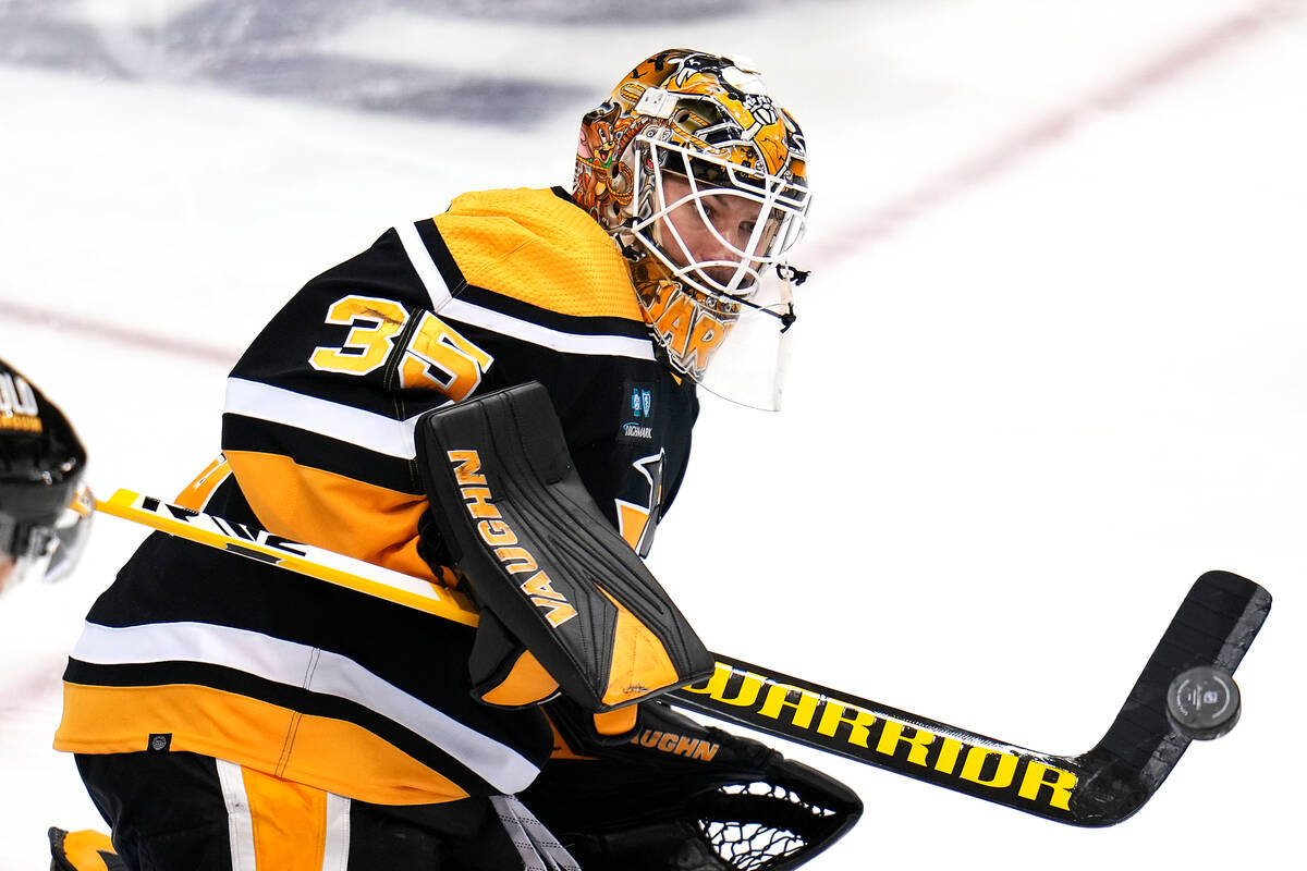 Pittsburgh Penguins goaltender Tristan Jarry deflects a shot during the third period of an NHL ...