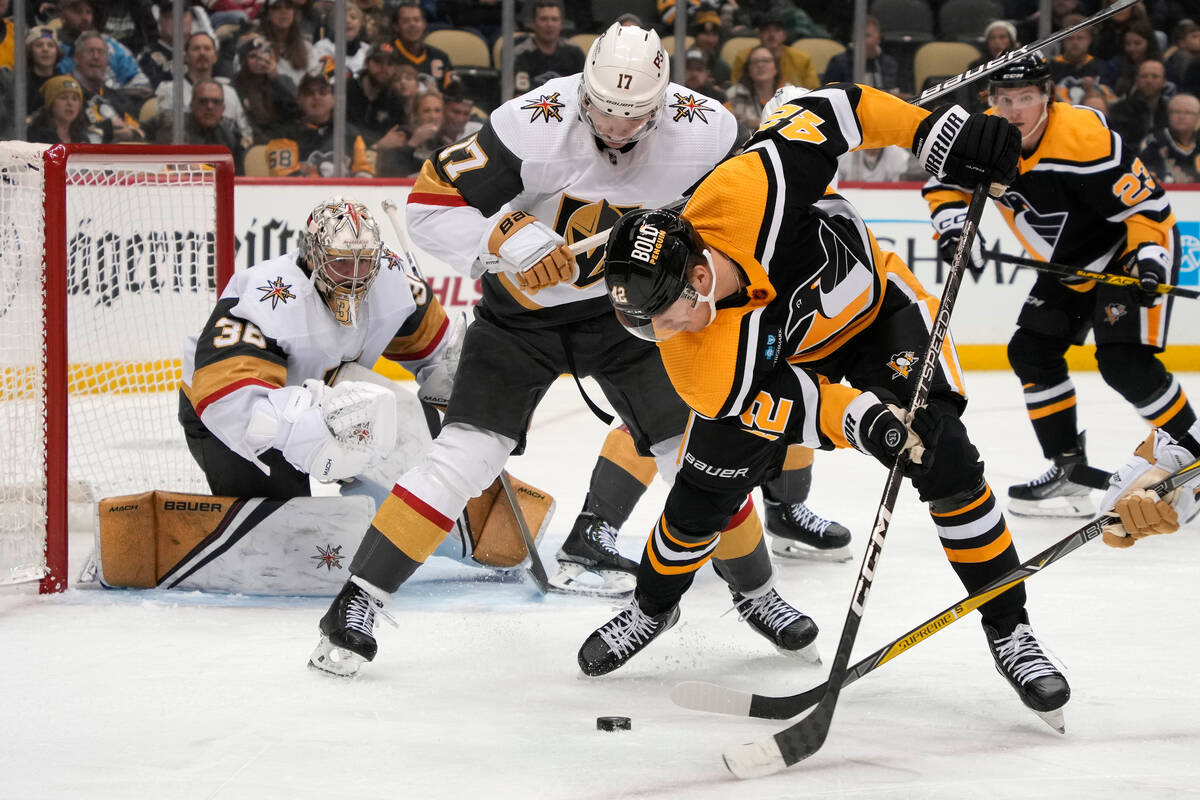 Pittsburgh Penguins' Kasperi Kapanen (42) tries to shoot in front of Vegas Golden Knights goalt ...