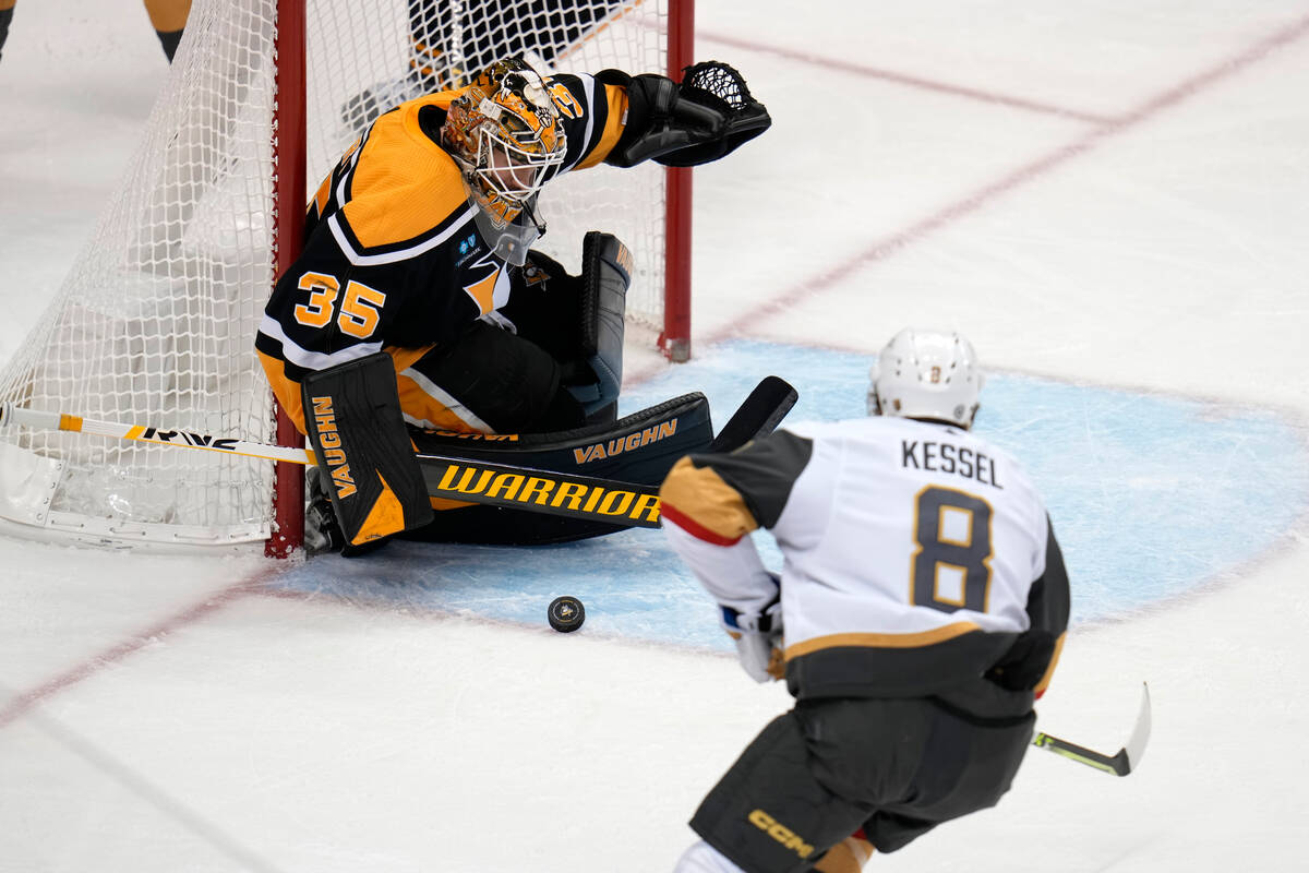 Pittsburgh Penguins goaltender Tristan Jarry (35) blocks a shot by Vegas Golden Knights' Phil K ...