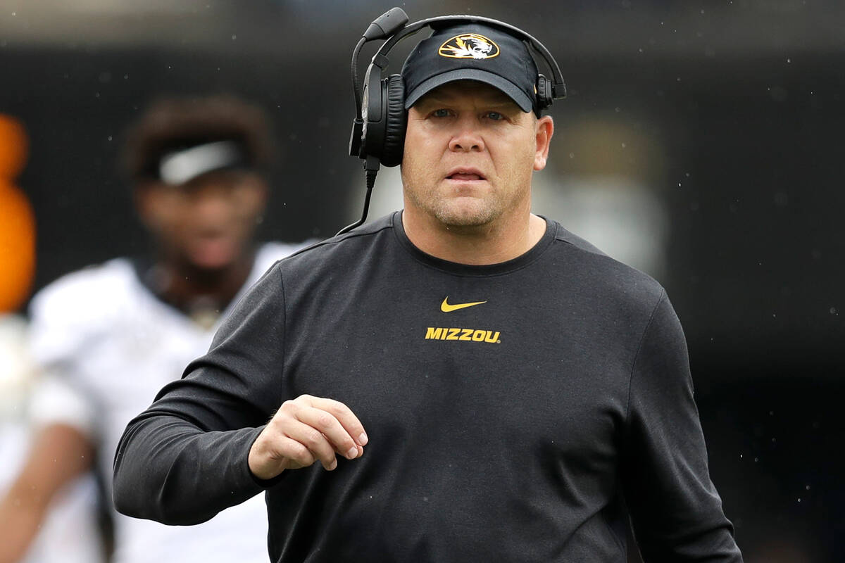 Missouri head coach Barry Odom watches from the sideline in the first half of an NCAA college f ...