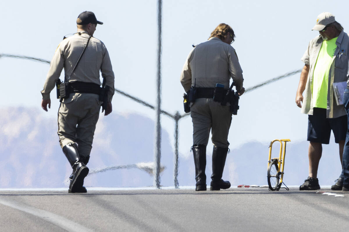 Las Vegas police investigate a fatal collision involving a motorcycle and a white truck at Sout ...