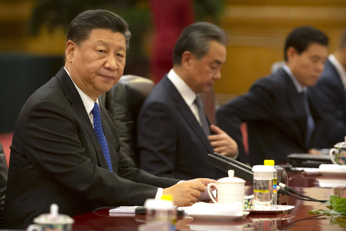 FILE - In this July 2, 2019, file photo, Chinese President Xi Jinping sits during a meeting at ...