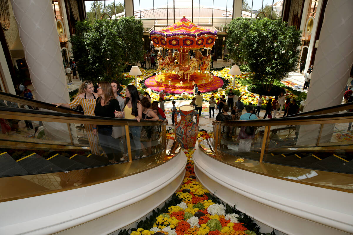 Guests explore the Garden Lobby and a Preston Bailey carousel during the opening of the $2.6 bi ...