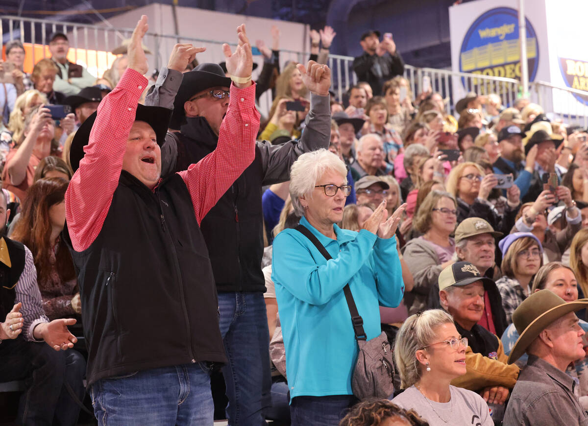 Fans cheer at the YETI Junior World Finals 2022 rodeo during Cowboy Christmas at the Las Vegas ...