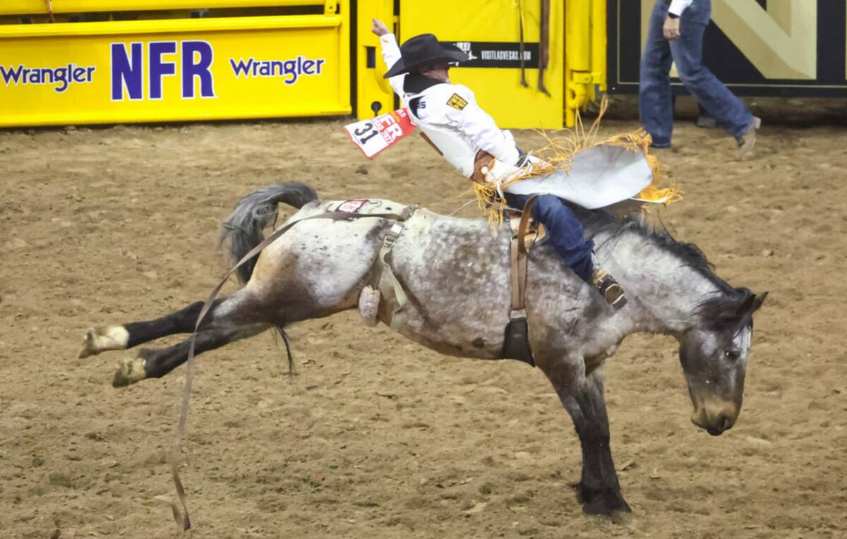 Kaycee Feild, of Genola, Utah, competes in bareback riding during the first night of the Nation ...