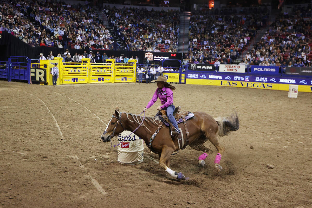Shelley Morgan competes in the barrel racing event in the 64th Wrangler National Finals Rodeo a ...