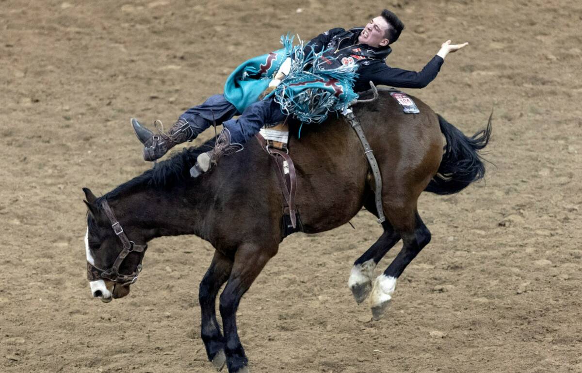 Jess Pope, of Waverly, Kan., competes in bareback riding during the seventh go-round of the Nat ...