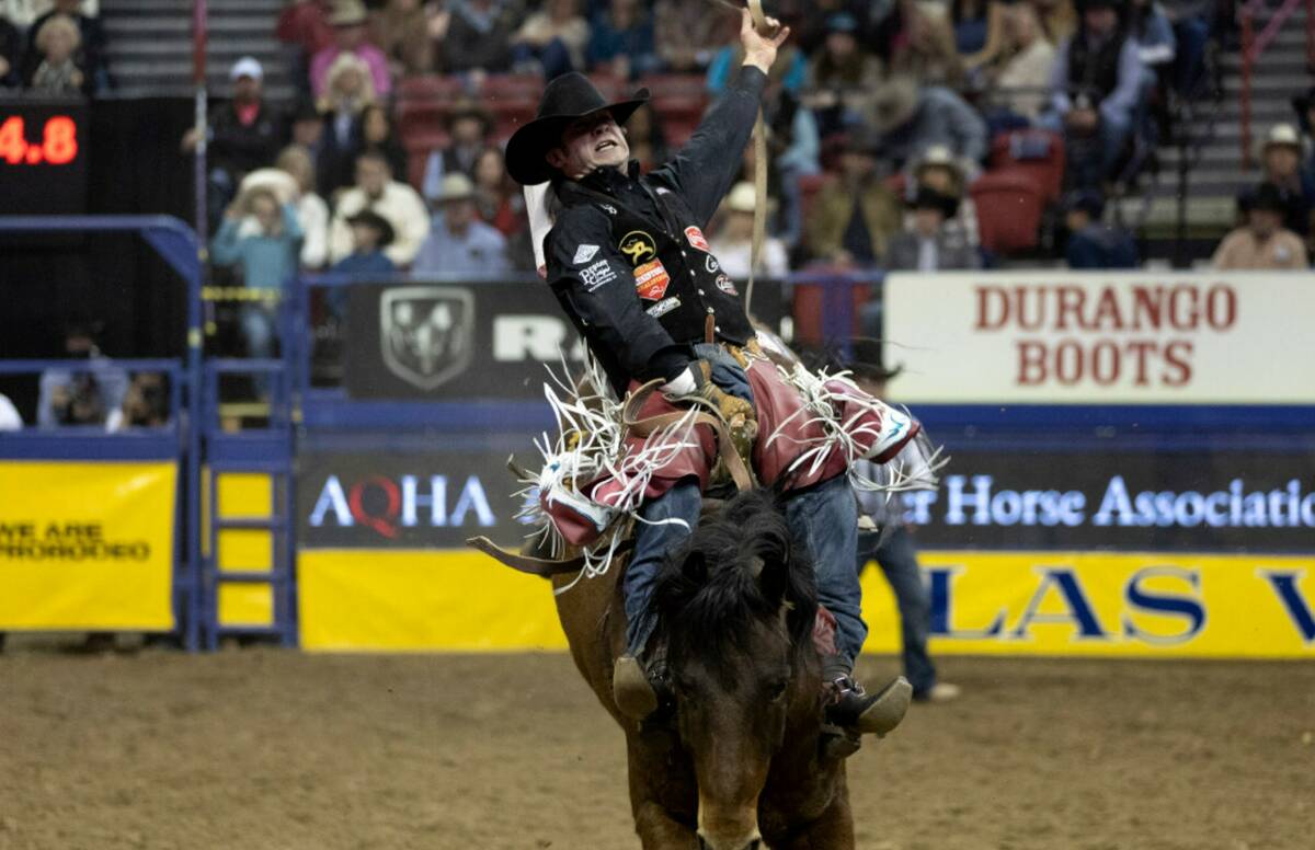 Leighton Berry, of Weatherford, Tex., competes in bareback riding during the eighth go-round of ...