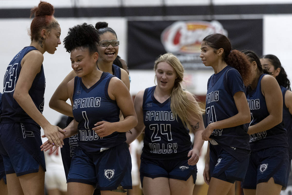 Spring Valley celebrates after their Mia Ervin (1) hit a three-pointer at the halftime buzzer d ...