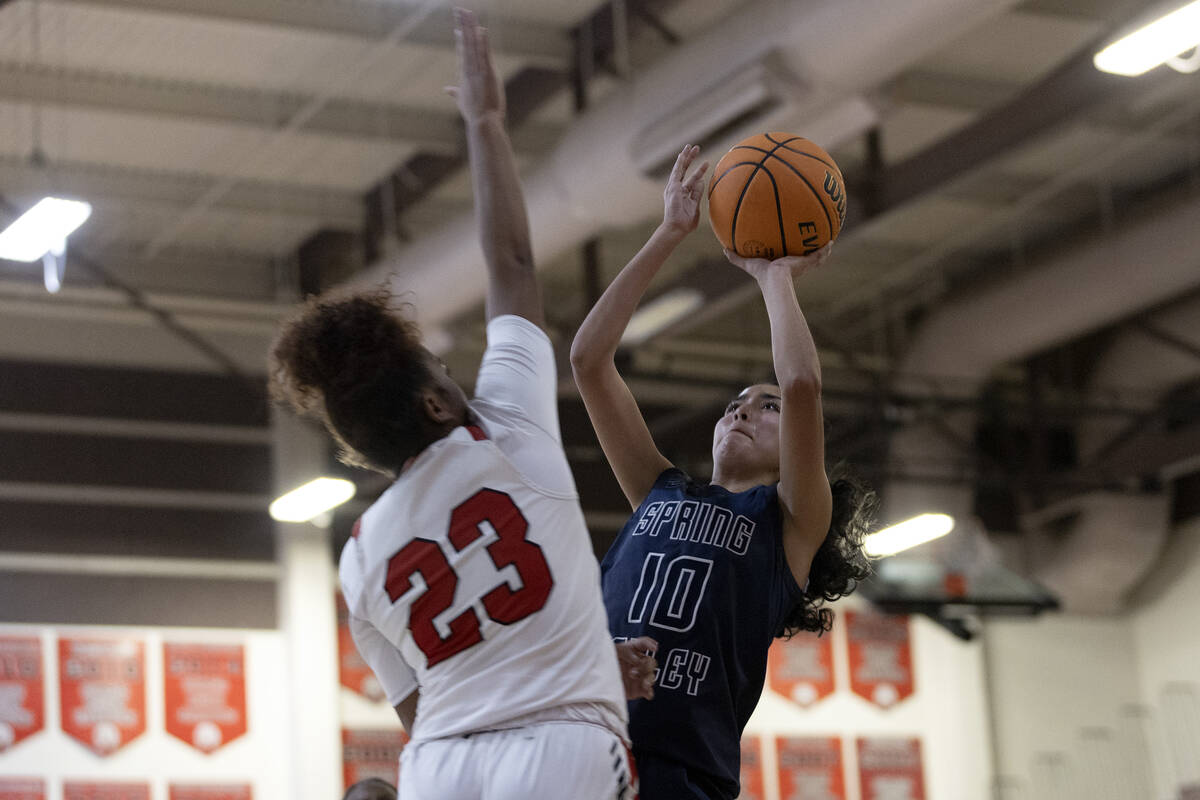 Spring Valley’s Melanie Ortiz (10) shoots against Las Vegas’ Kayla Terry (23) dur ...