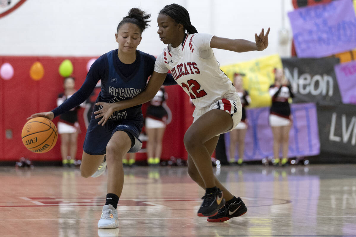 Spring Valley’s Gia McFadden (5) dribbles around Las Vegas’ Jaidyn Savoy, left, d ...